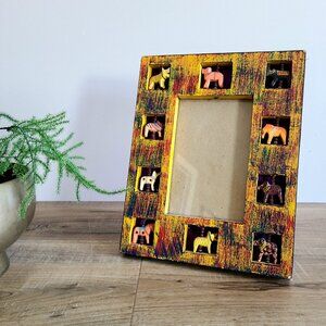 Indian wooden handcrafted picture frame with inserted moving animals.